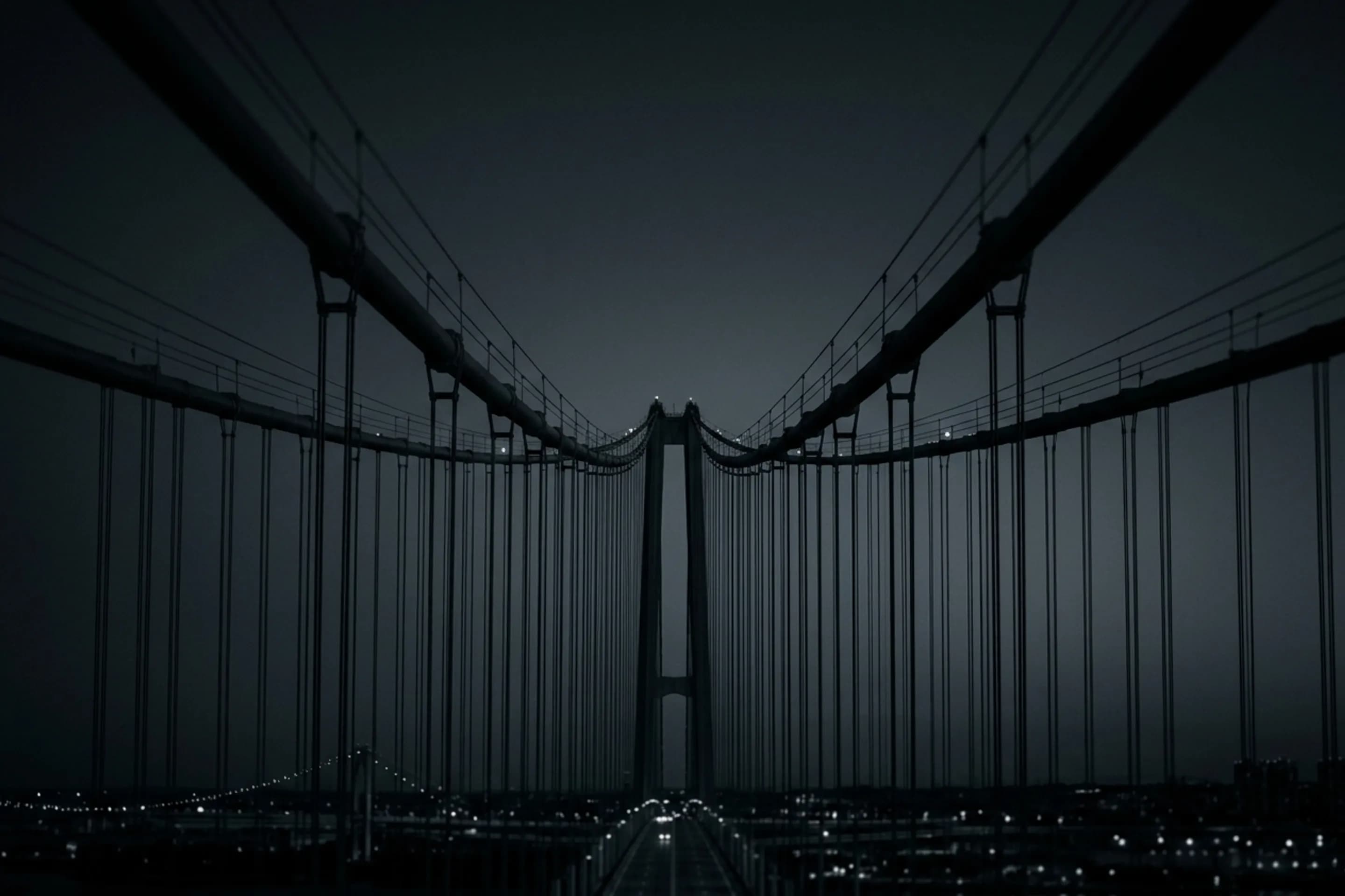 Suspension bridge cables at night — connection
